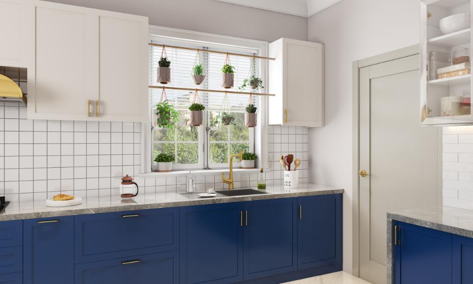 Navy blue shaker cabinets with marble counters for a coastal vibe