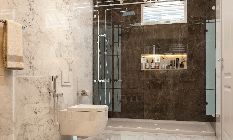 Luxury small bathroom design featuring marble tiles, glass partition shower, and wall niches.