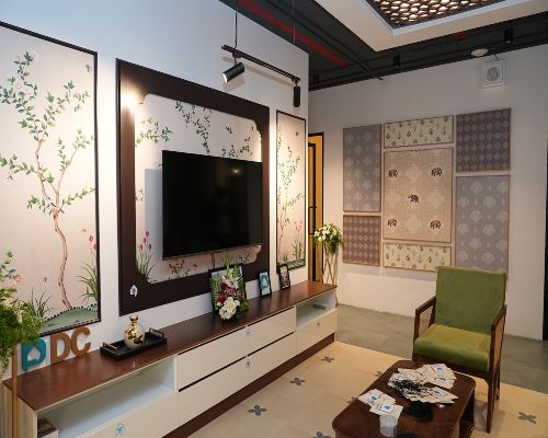 Living room setup with modern decor at DesignCafe showroom, hebbal