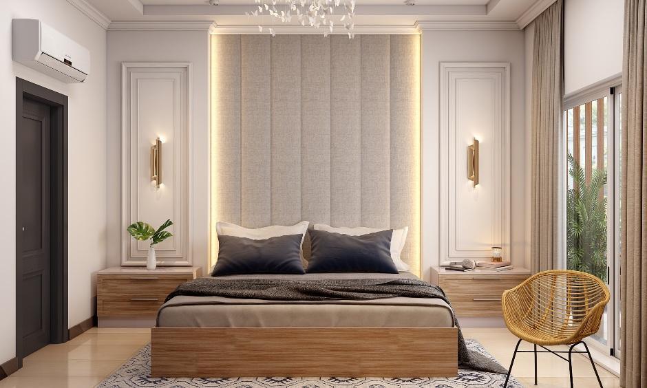Minimalist Italian bedroom with neutral beige walls, plush upholstered headboard, and expansive natural light.