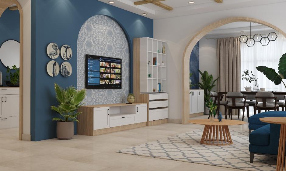 Italian interior living room with fresco wallpaper, abstract art, ceramic plates, and warm neutral tones.
