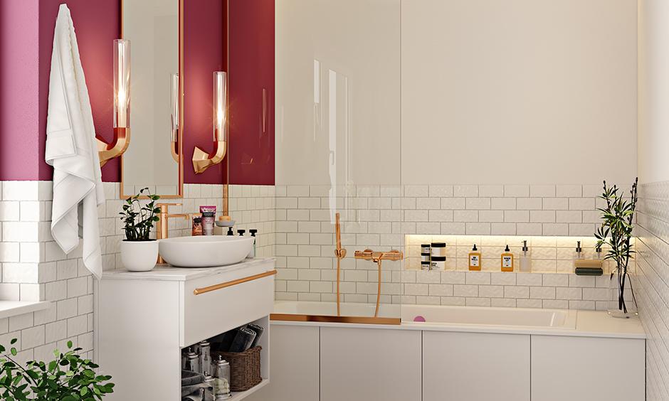 Bathroom with marble surfaces, gold fixtures, an arched mirror, and mosaic tiles showcases a luxurious Italian interior.