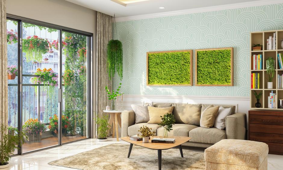 Personalising a rental home with vibrant cushions, greenery, and a stack of favourite books in the lounge.