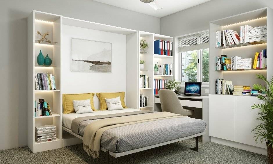 Rental house decor in a bedroom featuring under-bed storage bins and a woven storage trunk.