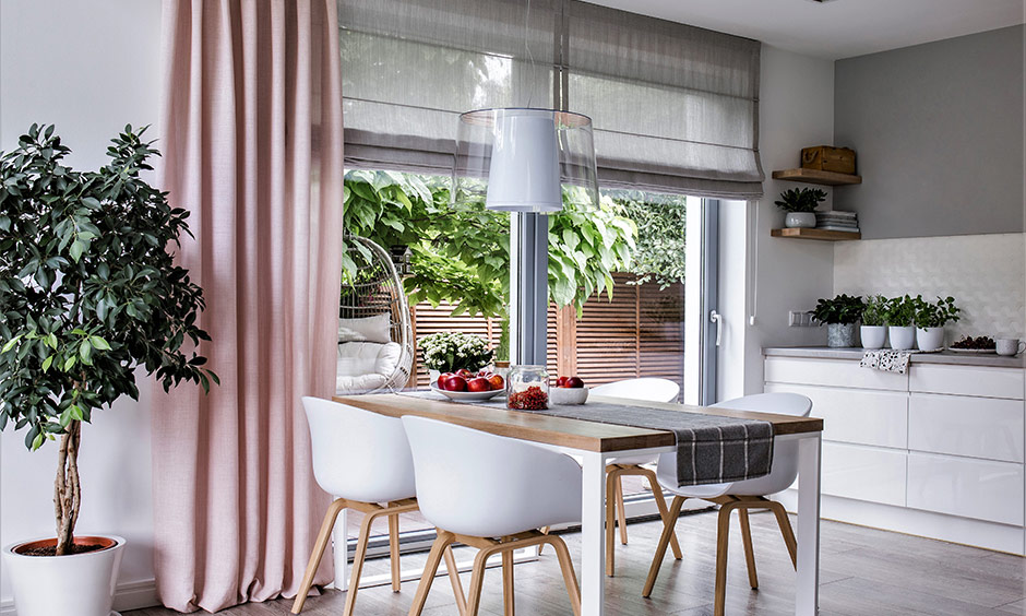 Pale pink kitchen sliding door curtain enhances the minimalist design, adding a chic and soft touch.