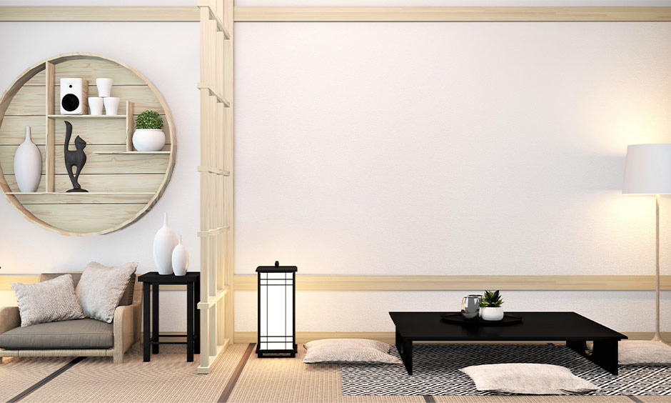 Japanese modern minimalist apartment with clean lines, floor cushions, and a low black table for serenity.