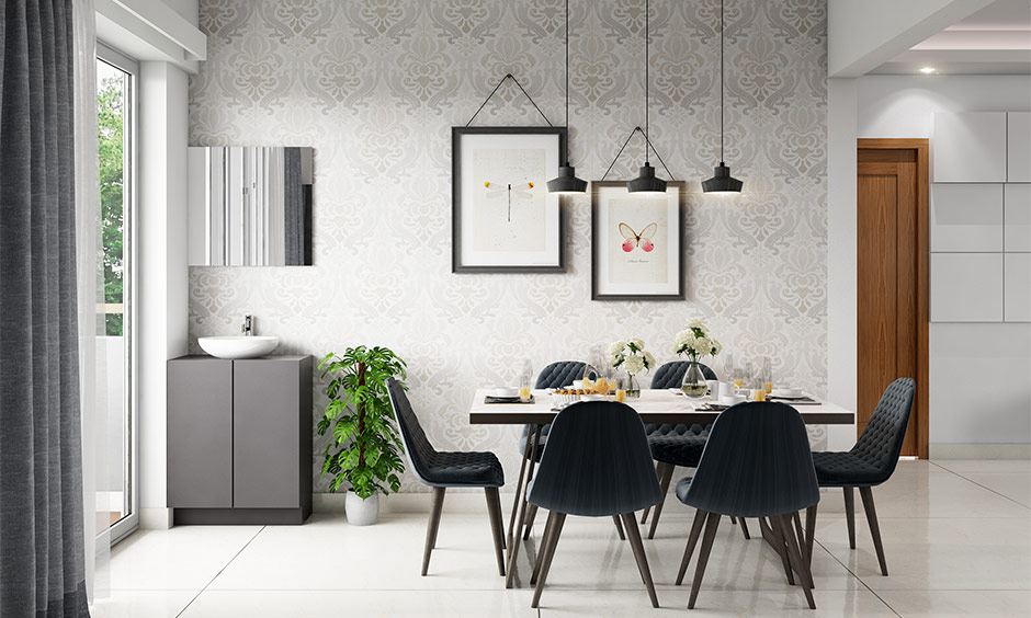 Bright, modern minimalist apartment dining room with pendant lights and a large sliding glass door.