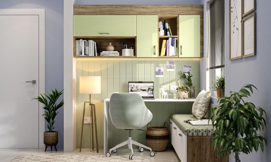 Light blue and green colour combination featuring sage upholstery and indoor plants for a calming space.