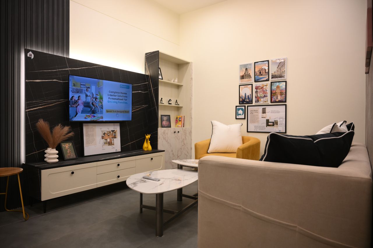 Chic living room with a sleek TV unit concept by DesignCafe, blending comfort and style.
