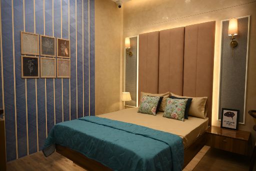 Inviting bedroom design by DesignCafe, combining comfort and modern aesthetics.