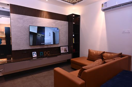 Contemporary living room with an L-shaped TV unit design in Bhubaneswar, enhancing space and functionality.