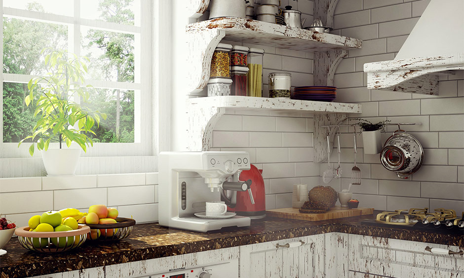 Brown granite kitchen platform material in a modular kitchen with white cabinets, showing easy maintenance and care.