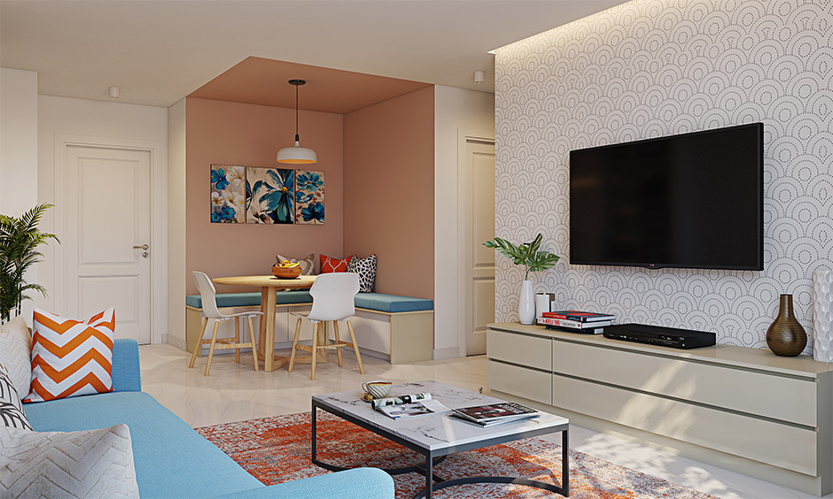 Interior design in Bhubaneswar showing a modern living room with dining corner, TV unit, and vibrant decor.