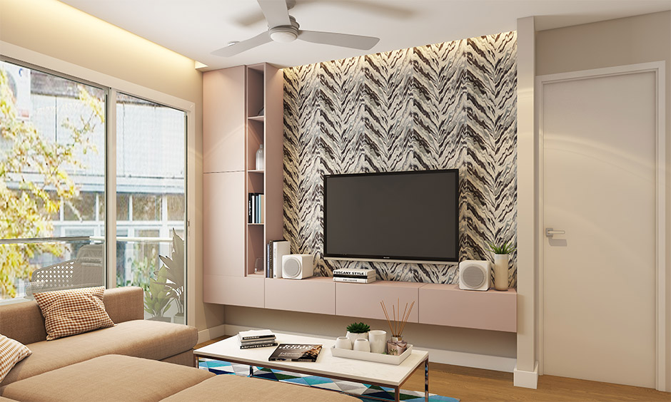Interior design in Bhubaneswar showcasing a stylish living room with a TV unit, wall finishes, and contemporary decor.
