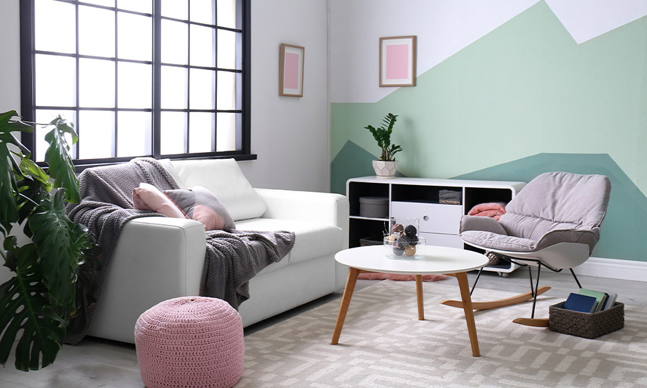 Easy wall paint design with tape mimicking mountains in a modern living room.