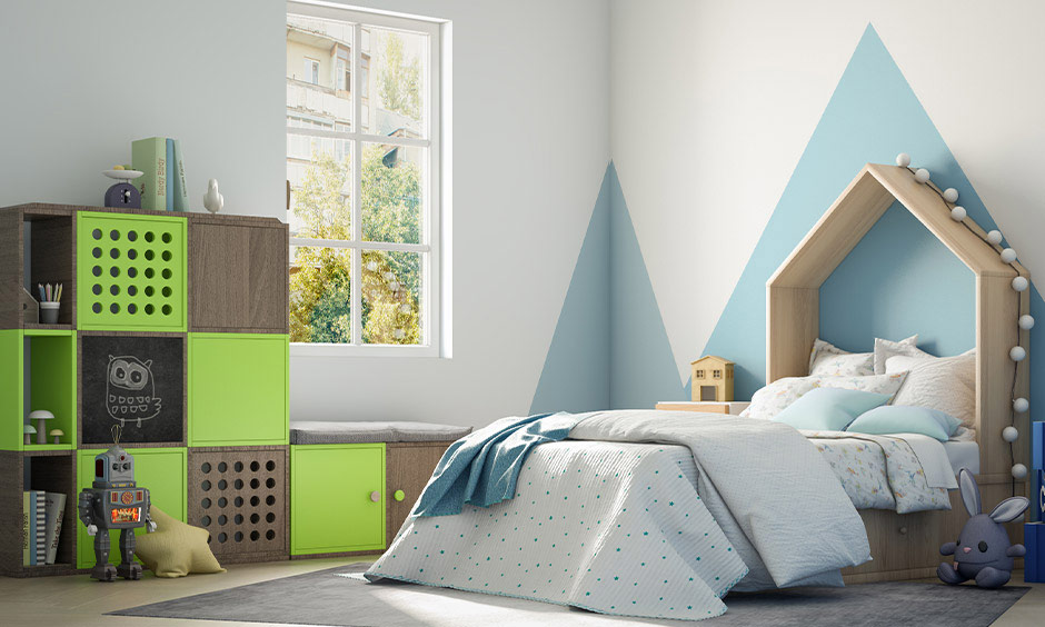 Children's bedroom with simple wall design using tape, featuring sky blue triangle motifs.