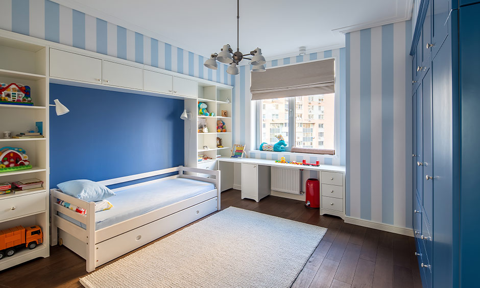 Soft blue and white easy wall paint design with tape for a children's room.