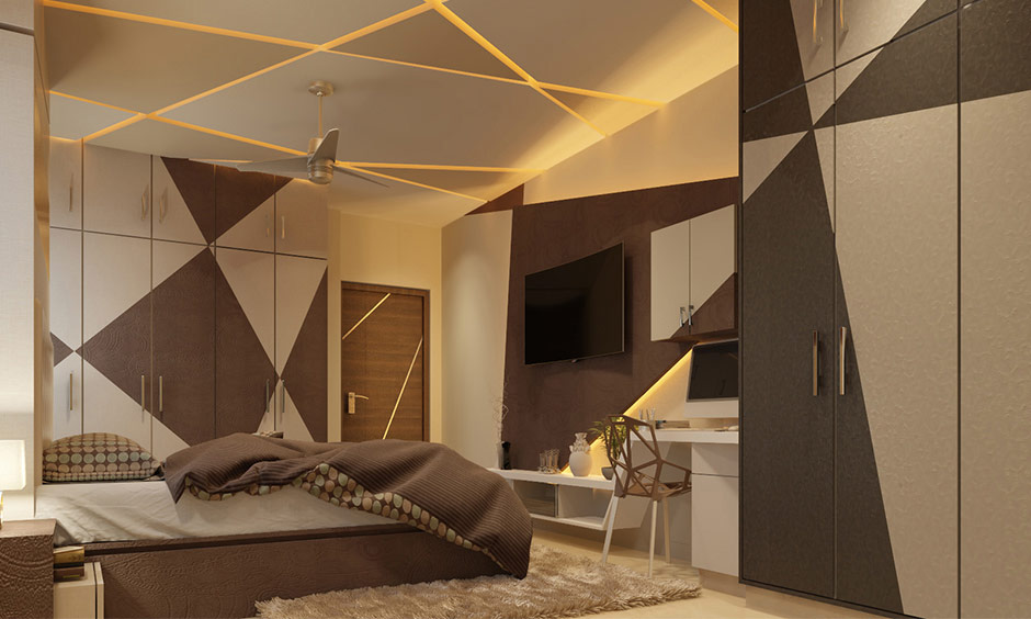 Bedroom with wall paint design using tape, featuring intersecting lines on walls, ceiling, and wardrobes.