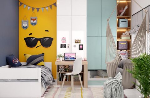Kids' bedroom design with a study table, hammock chair, and bright yellow accent wall.