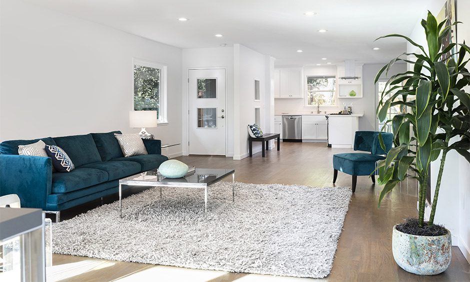 Layered rugs adding warmth and texture for an affordable living room upgrade