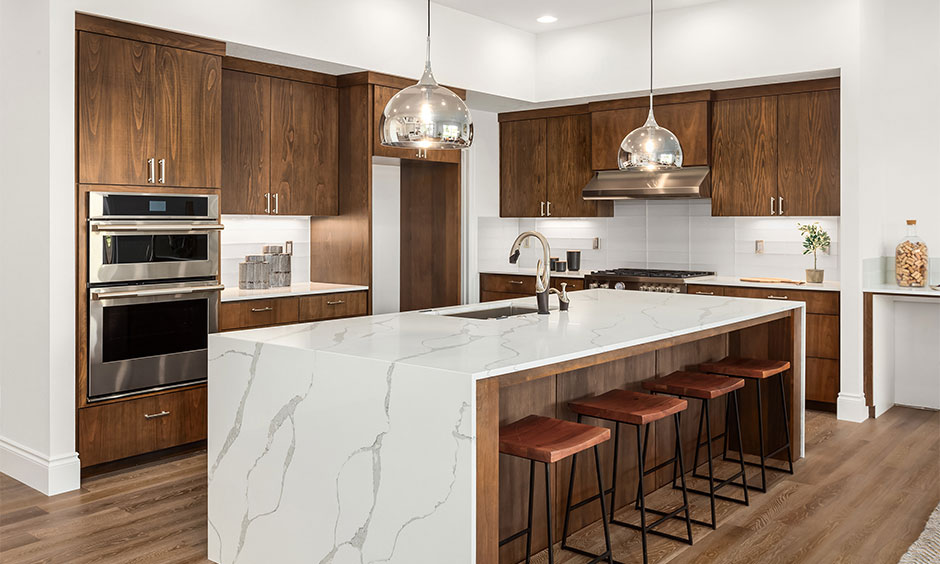 Waterfall-style marble kitchen countertop, which exudes a luxurious look