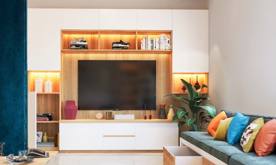 Wall-mounted TV unit with storage and integrated lighting for decoration and extra storage space.