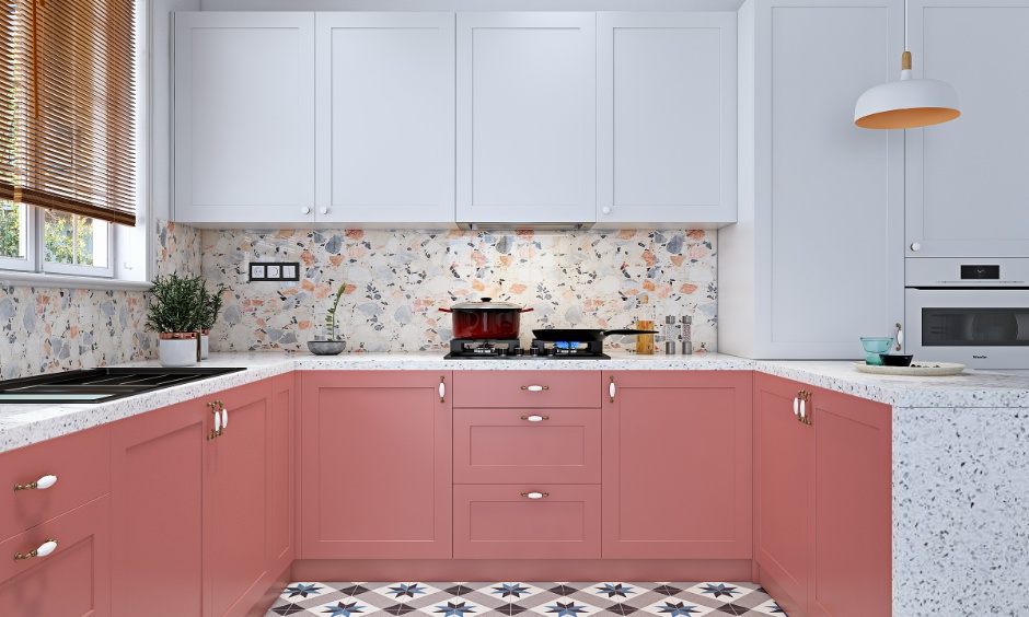 Modern pink cabinets with a traditional terrazzo wall for a timeless look