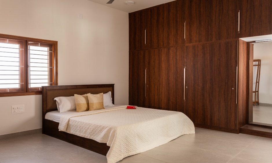 2 BHK bedroom in Daisy Avenue, Coimbatore featuring a serene wall-to-wall wardrobe.