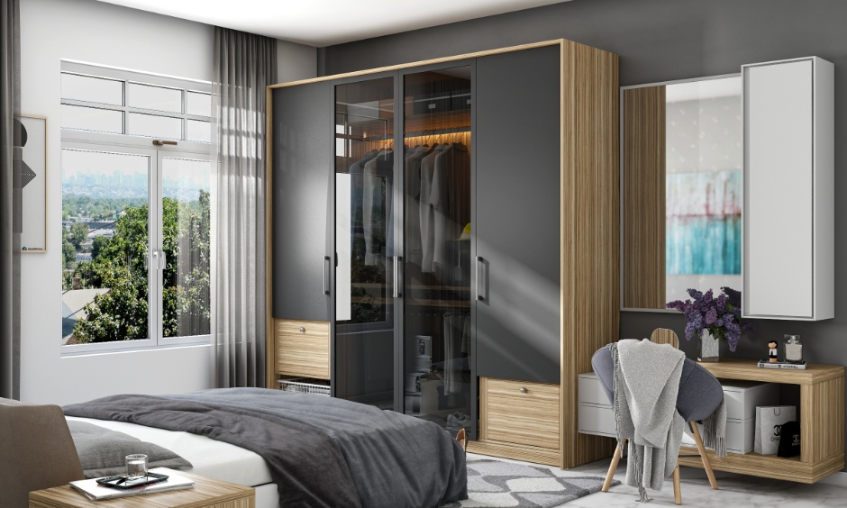 Sliding glass finish wardrobe with frosted panels creating a sleek, modern and visually spacious bedroom design.