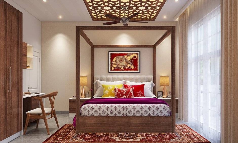 Mysore-inspired bedroom with vibrant textiles, patterned fabrics and elegant wooden furniture.