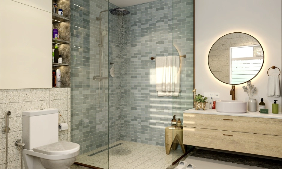 A contemporary bathroom with blue tiles and a clear glass shower partition.