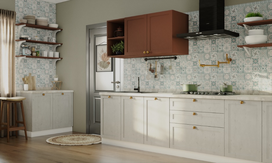 Soft off-white cabinets and earthy accents following warm neutral kitchen colour trends.