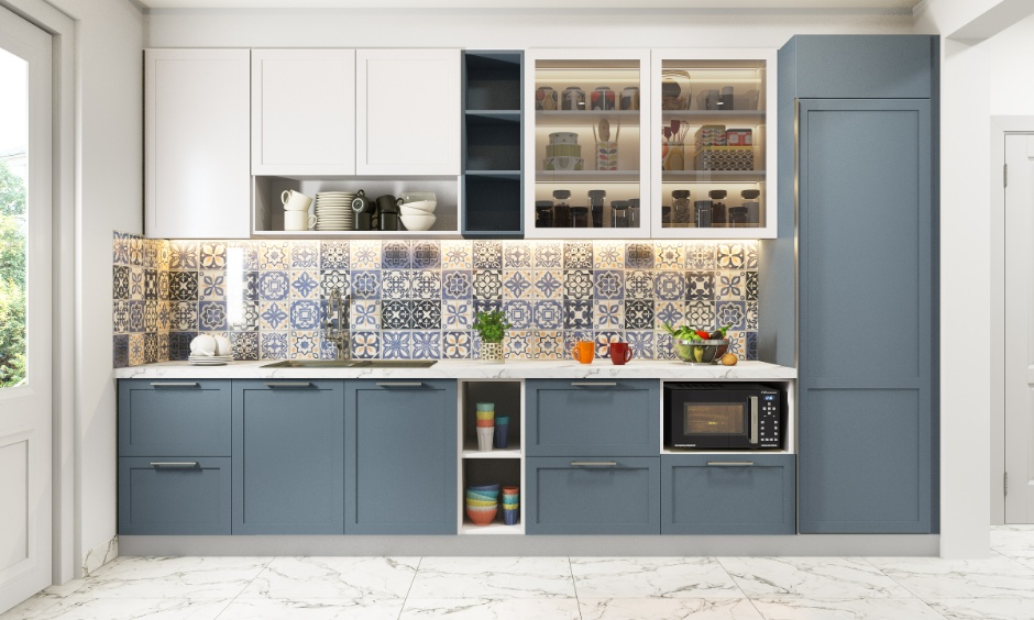 Trending kitchen cabinet colours in soft blue-grey paired with patterned backsplashes for depth.