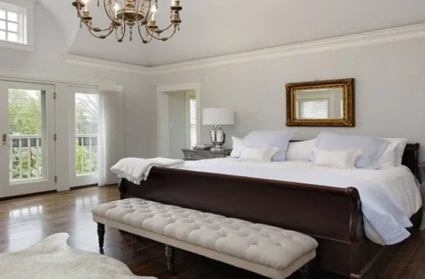 Master bedroom design for a room with wooden flooring and white walls in master bedroom wall decor