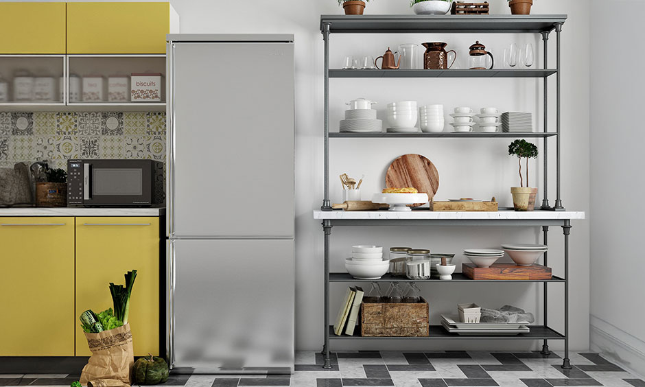 Open-display kitchen pantry unit with industrial steel shelves and marble counter for easy access