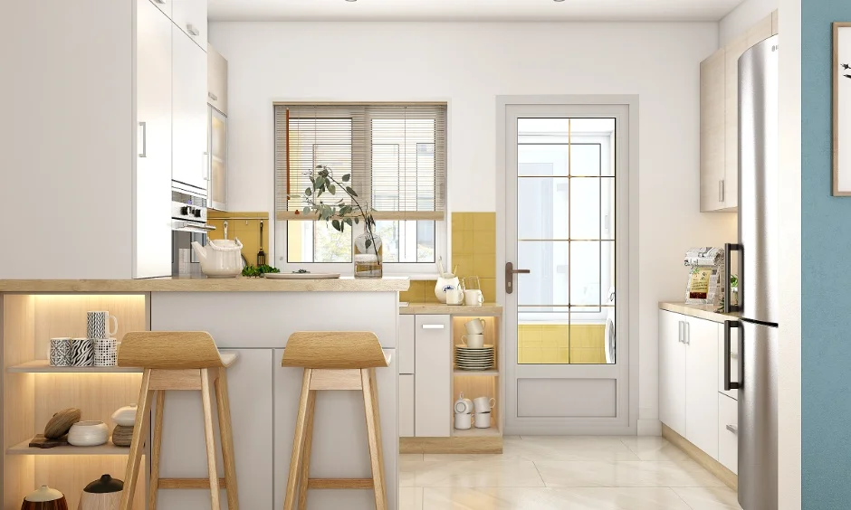 A bright white kitchen with light cabinetry and dining seating makes the space feel more open.