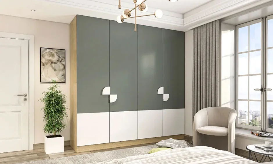 Interior design cost in Chennai for a four-door swing wardrobe in grey-green and white with half-circle handles.