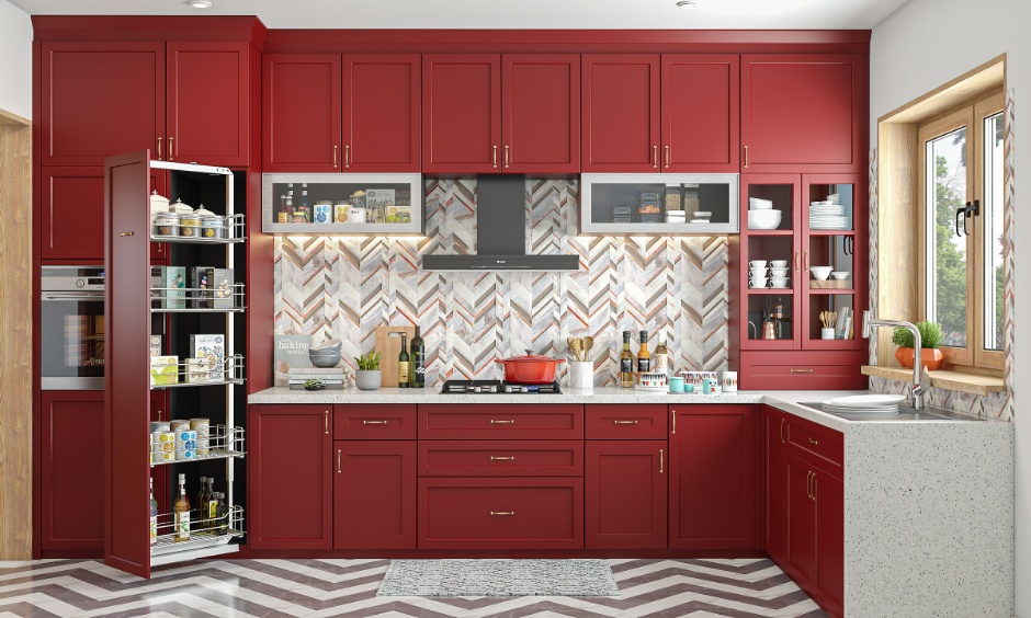 Red modular kitchen with herringbone pattern showing kitchen backsplash tile layout trends for 2026