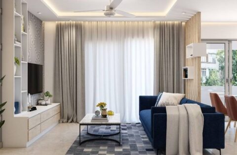 A simple living room design with sofa and false ceiling showcasing 2BHK interior design cost planning