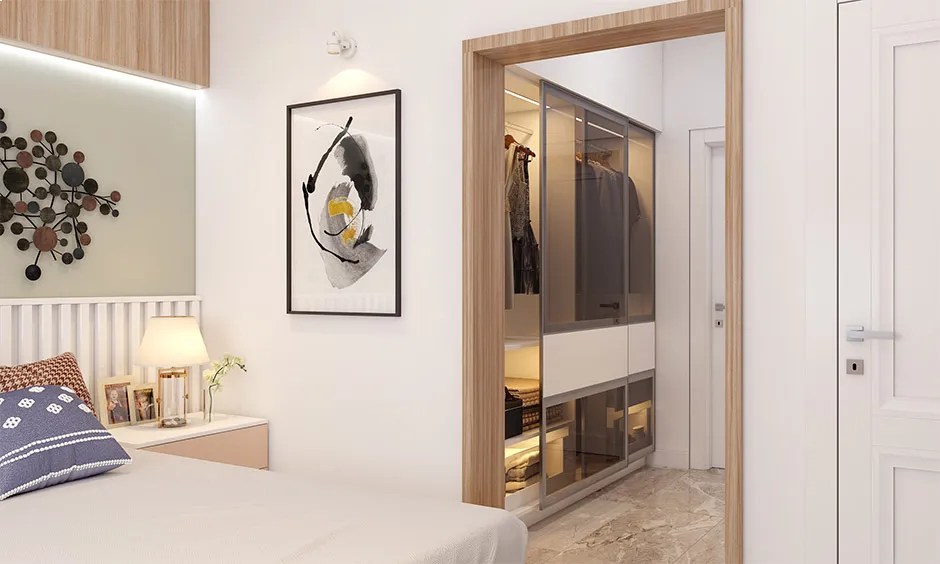 Walk in wardrobe with glass partition that enhances space and impacts modular wardrobe price
