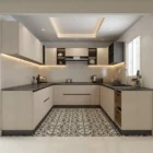 Recessed tray ceiling with cove lighting keeps this U-shaped kitchen bright.
