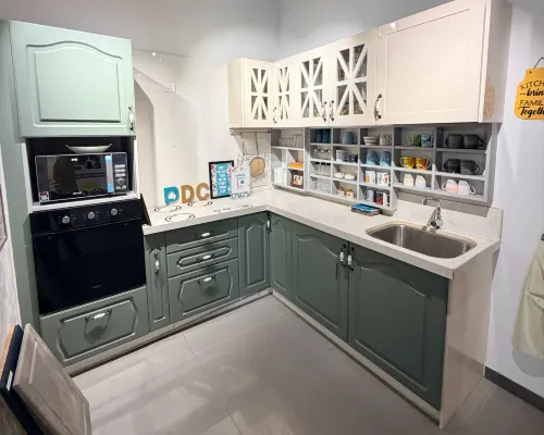 Modern L-shaped modular kitchen design at Gandhinagar interior studio.