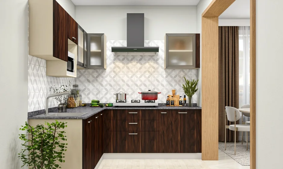 A modern kitchen uses dark cabinetry, a light worktop and integrated storage.