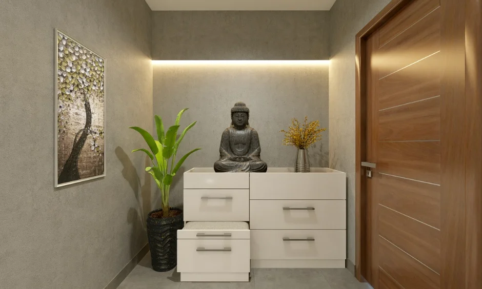 Foyer unit with Buddha statue, wooden door, and wall art in a 1 BHK interior home.