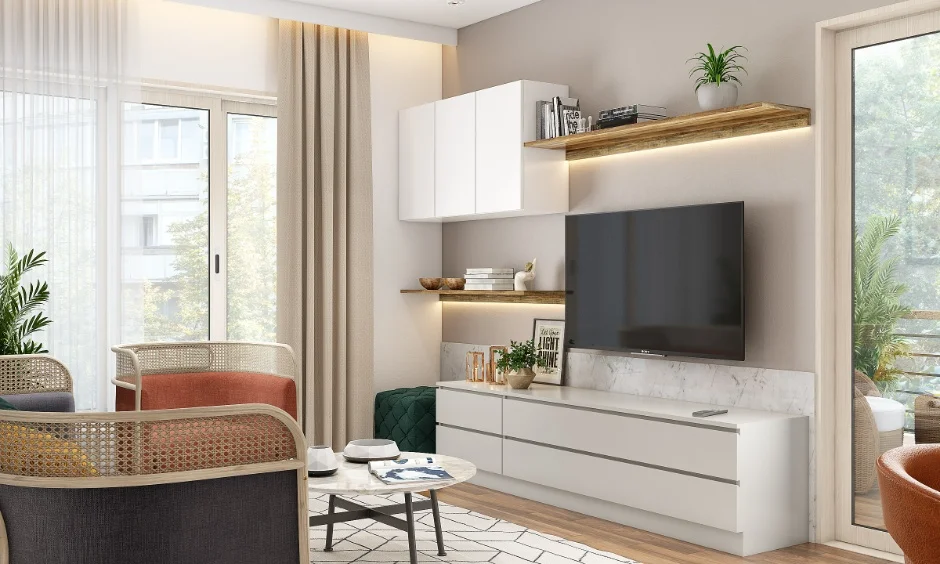 Living room with TV unit, wooden shelves, and cane chairs in a 1 BHK interior home.