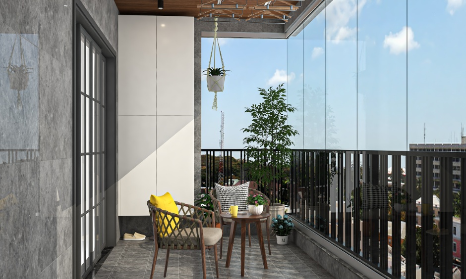 Covered balcony with black metal grill, glass windbreak panels, outdoor chairs and potted plants designed for safe, rainproof use.