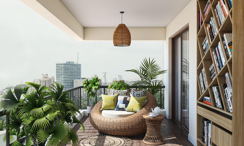 Modern balcony with black metal grill, rattan sofa, plants and bookshelf overlooking the city.