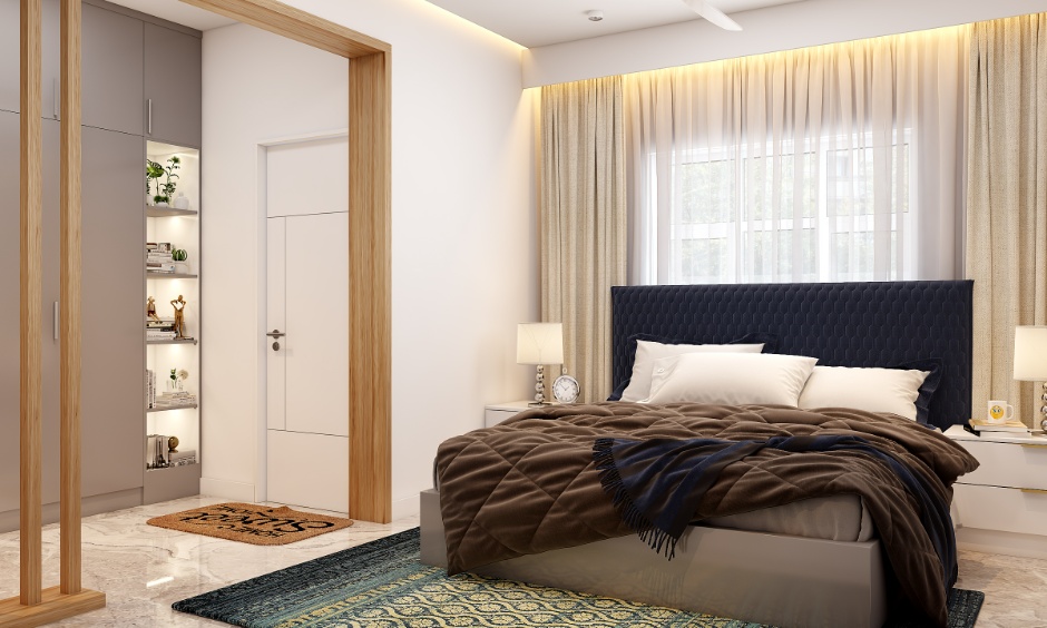Modern 2BHK bedroom interior cost in Hyderabad featuring a padded headboard bed, bedside tables with lamps, and warm curtain lighting