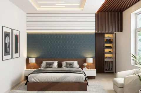 A gypsum ceiling with cove lighting creates a layered finish in an Indian bedroom.