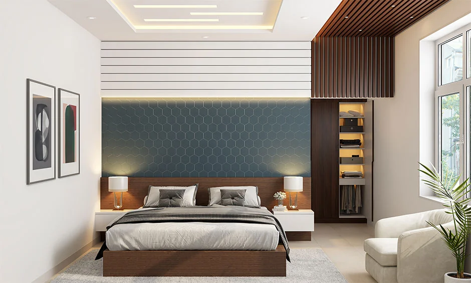 A gypsum ceiling with cove lighting creates a layered finish in an Indian bedroom.
